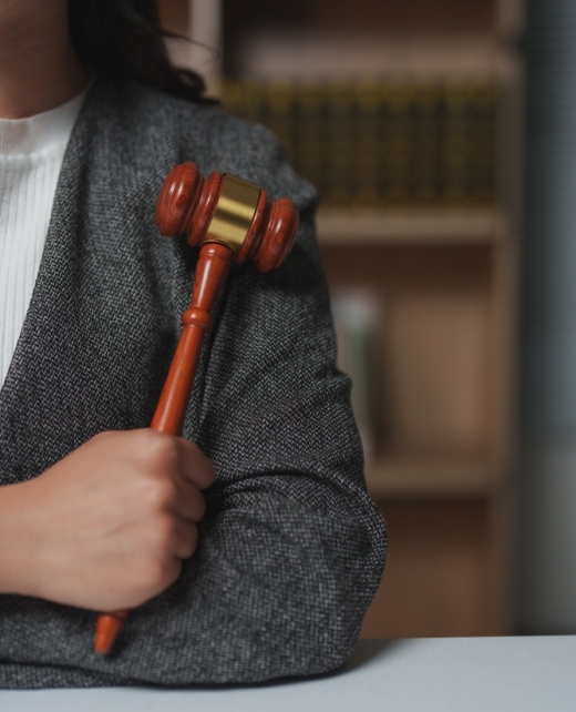 Female,Lawyer,Confidently,Holding,A,Gavel,In,A,Courtroom,,Embodying